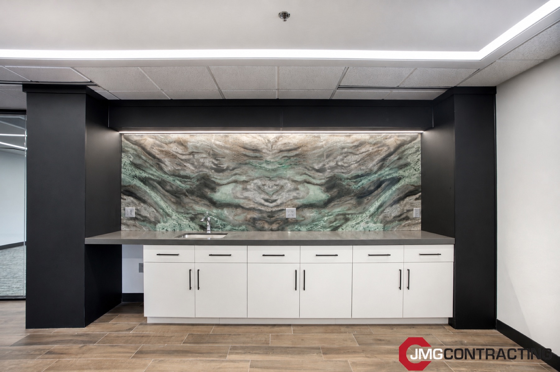 87th St Suite 120 — Book-Matched Stone Backsplash & Break Area